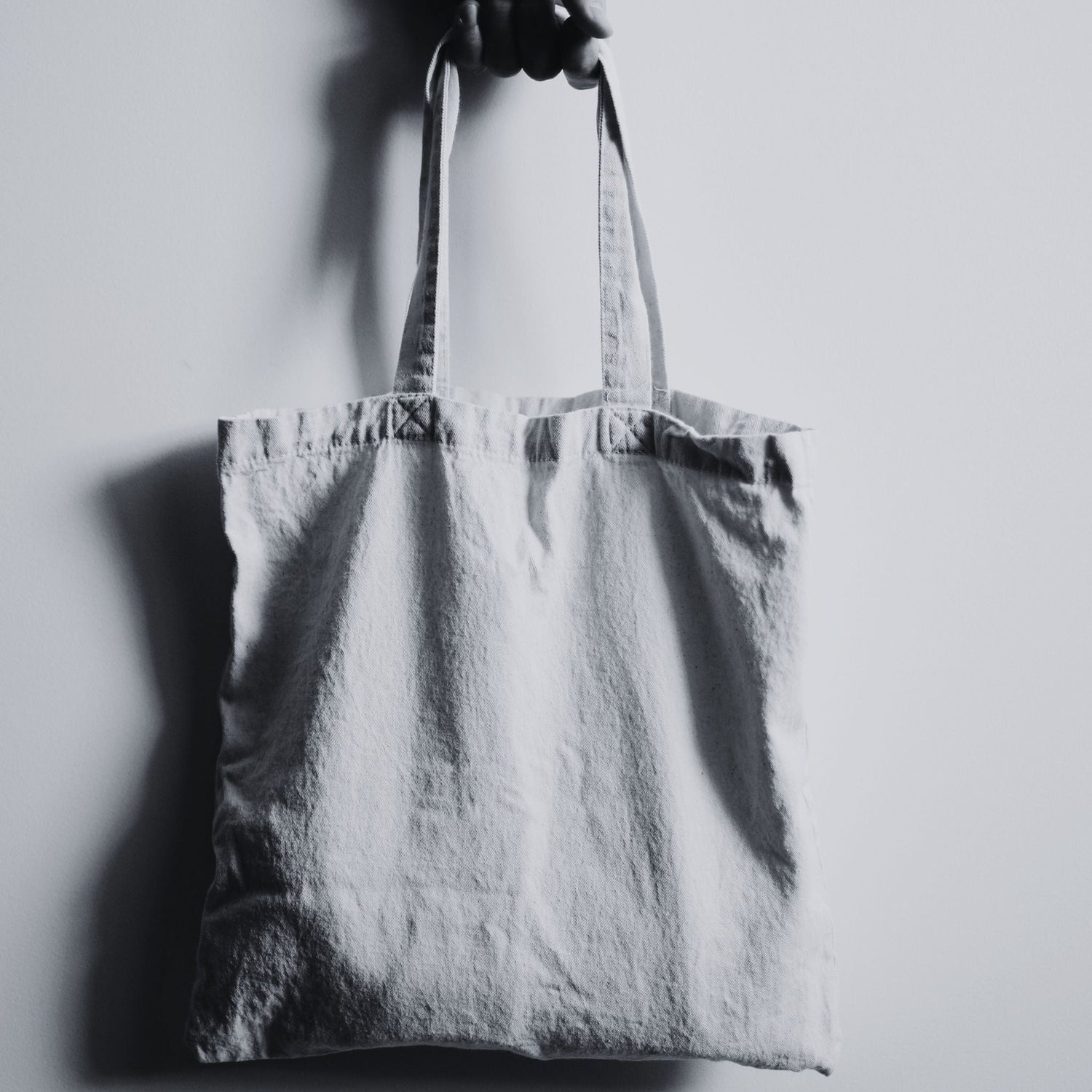 Minimalist accessories like totes and stickers designed to inspire healing and conscious expression.